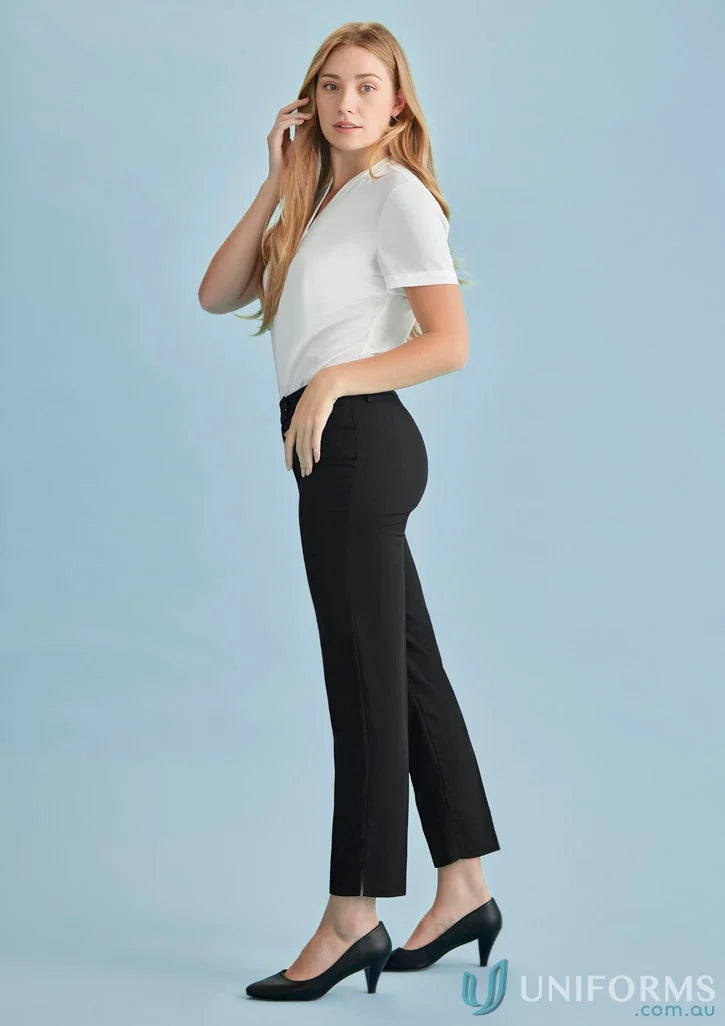 Woman in black cool stretch slim leg pants and white top for womens cool style