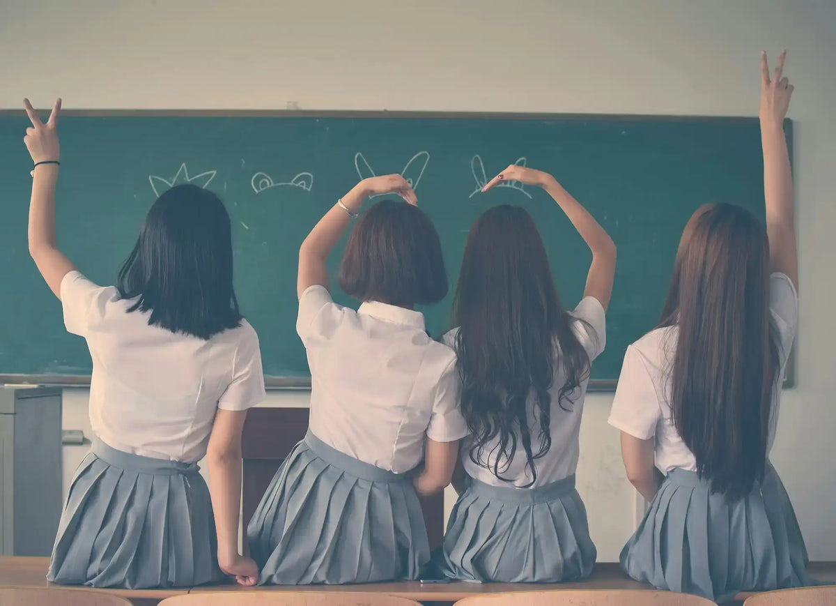 Four schoolgirls posing.