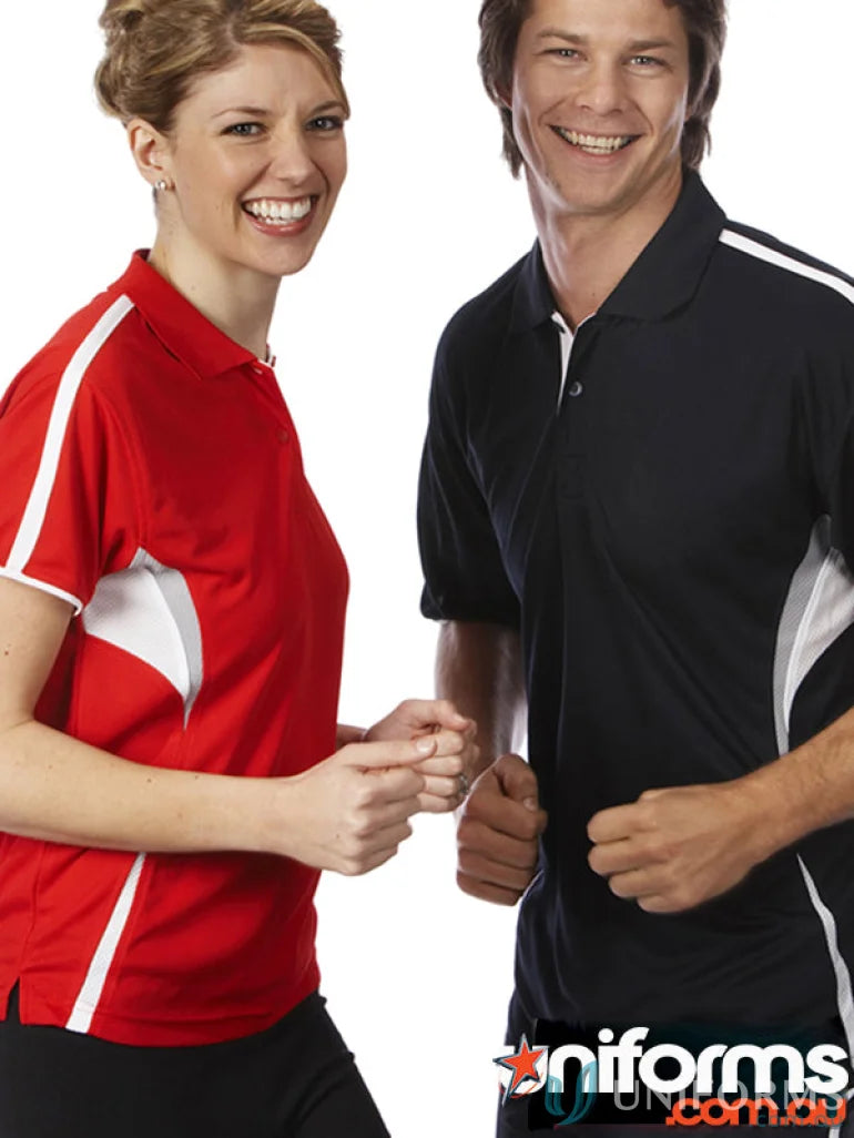 Two people wearing JBs Podium Cool polo shirts with dual-color body panels and moisture-wicking tech