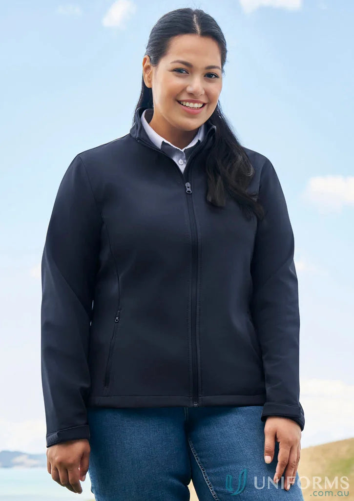 Woman in navy ladies Apex Softshell Jacket, perfect for biz collection womens style