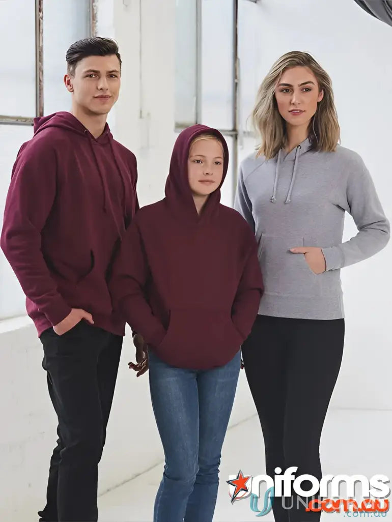 Three women wearing stylish hoodie uniforms for workwear or casual looks