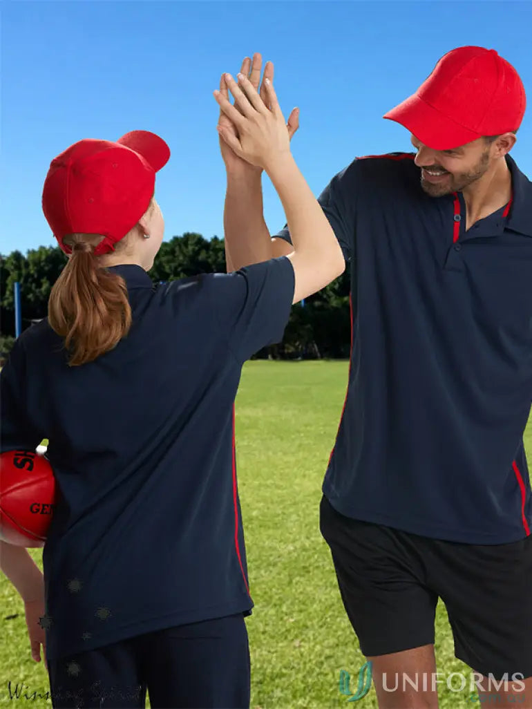 Two people high-fiving in matching navy and red athletic wear featuring MOQ50 Embroidered Caps, price includes embroidery on heavy brushed cotton