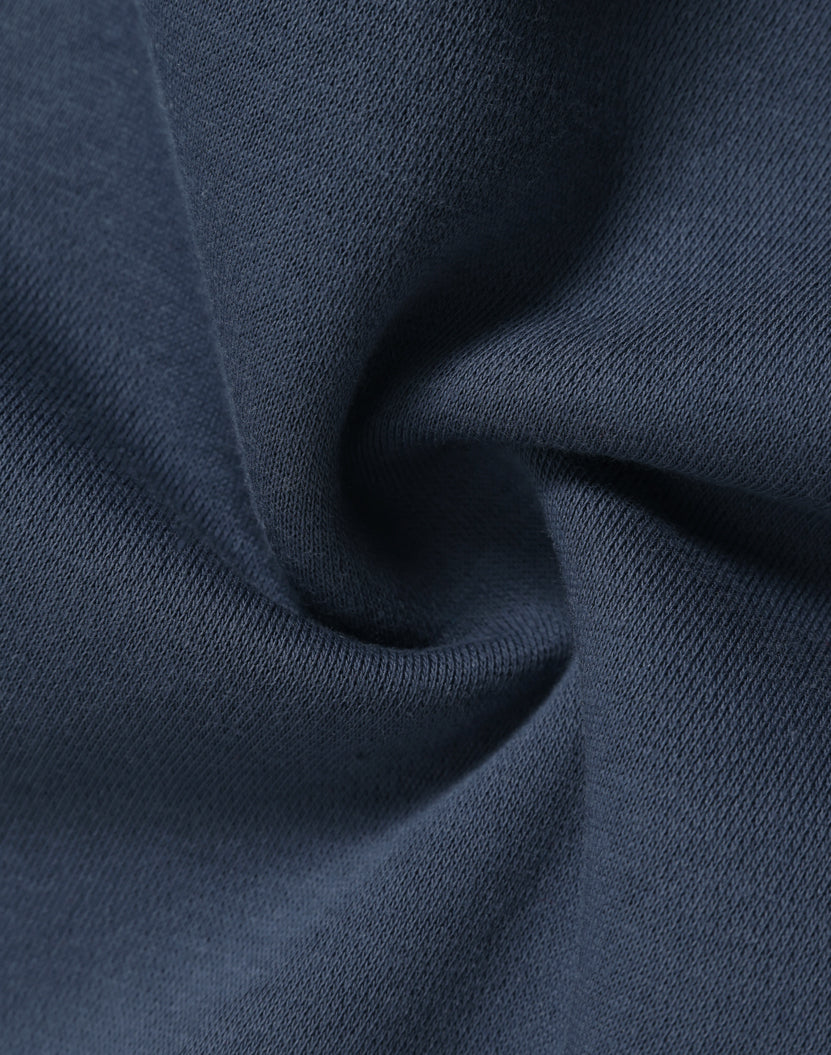 Dark blue knit fabric with soft textured weave on premium oversized slate hoodie ideal for workwear and uniforms