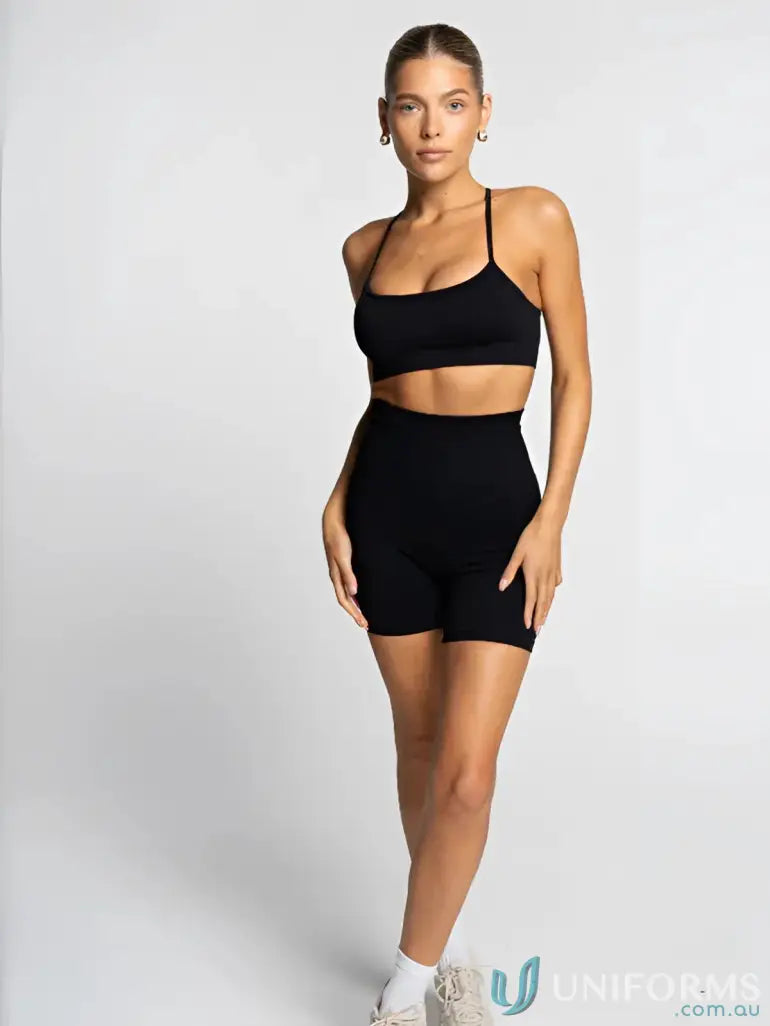 Black athletic set featuring Seamless Invicible Scrunch Onyx Shorts for workout wear