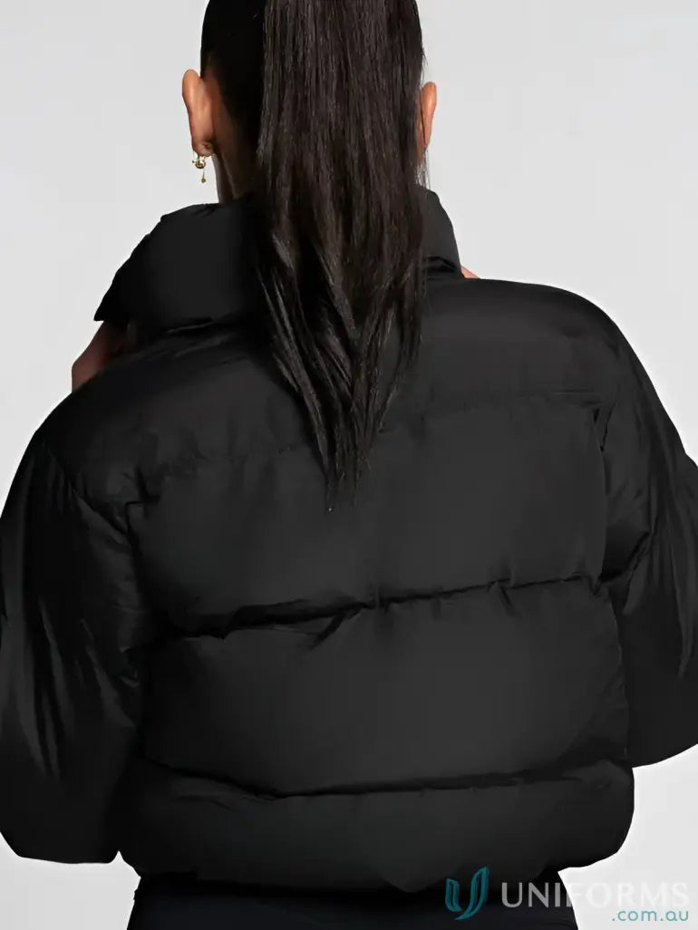 Black short puffer jacket with high collar and quilted design perfect for work uniforms and workwear looks cozy