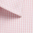 Westgarth Gingham short sleeve shirt with elongated triangular shadow on beige surface