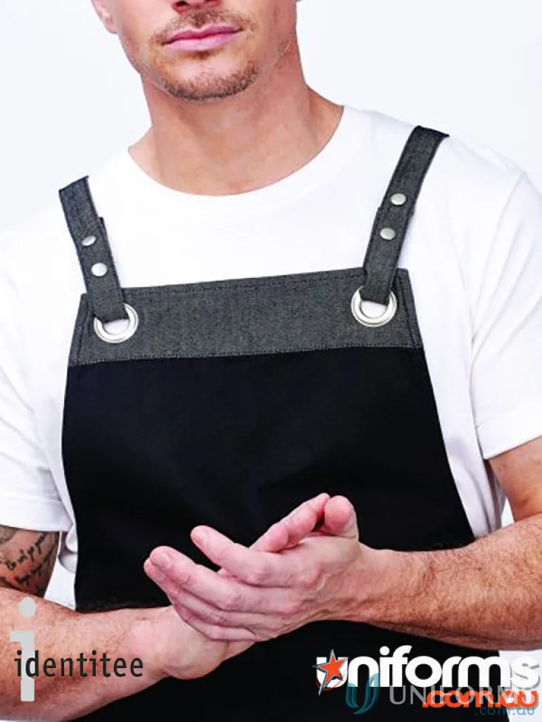 Man wearing Xavier Cross Over Apron Strap with black apron and gray denim straps