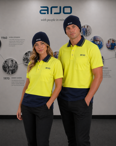Arjo emb s26 beanie with bright yellow and navy blue polo shirts featuring contrasting collar and sleeve trim for workwear uniforms