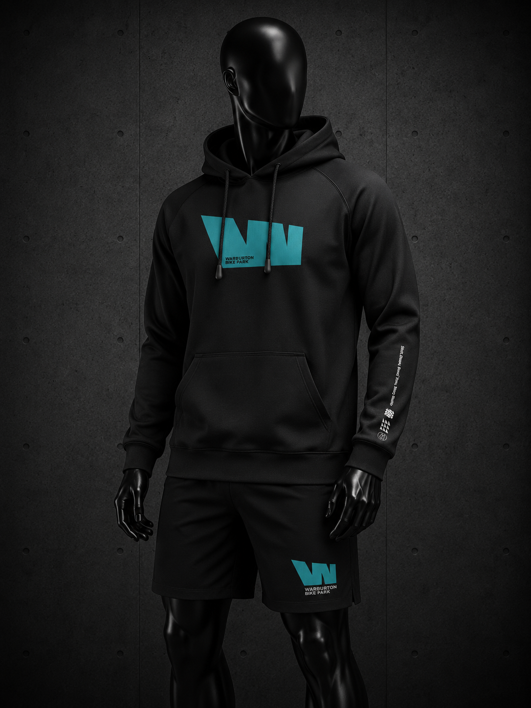 A black athletic hoodie and matching shorts set displayed on a glossy black mannequin against a dark textured wall. The hoodie features a large turquoise 'W' logo on the chest with 'WAVE SPORT' printed underneath, and a smaller matching logo on the left thigh of the shorts.