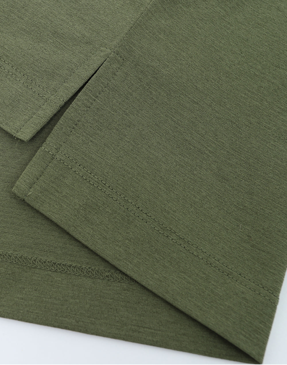 Close-up of green fabric with a white background