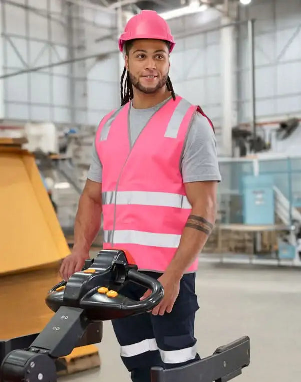 Man operating a pallet jack in sw43 safety vest with high visibility from AIW Safety