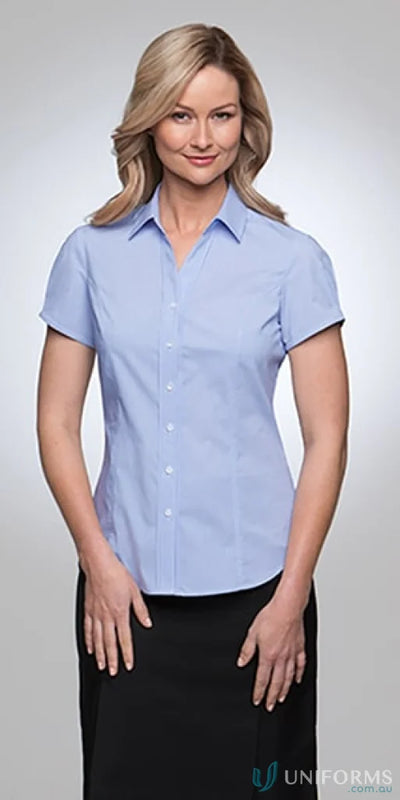City stretch ladies SS Pinfeather woman in light blue short-sleeved shirt and black skirt