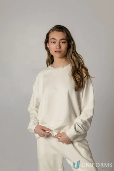 Woman in matching cream Archie Crew Sweat and pants showing cozy Archie Crew Sweat look