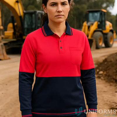 Woman wearing a red and navy HiVis LS Pocket Polo, perfect for casual or work wear