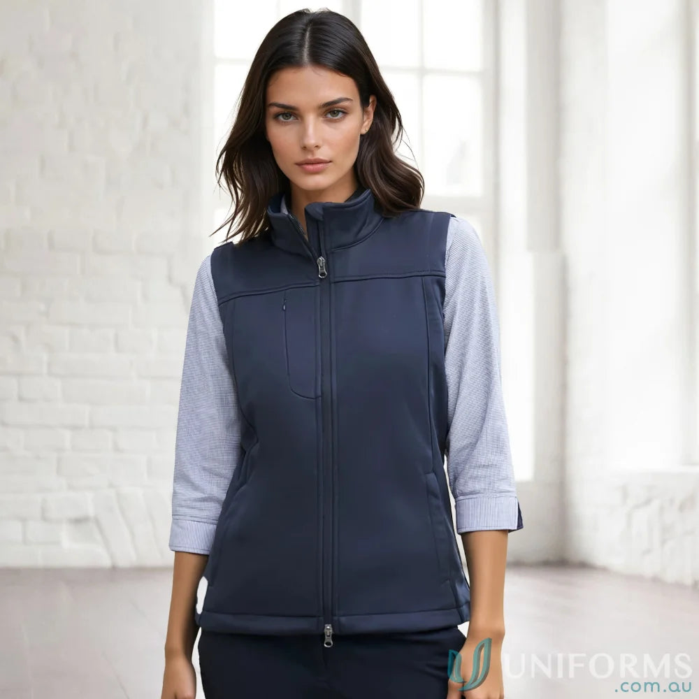 A womans navy blue sleeveless vest with a full zipper closure and a stand-up collar.