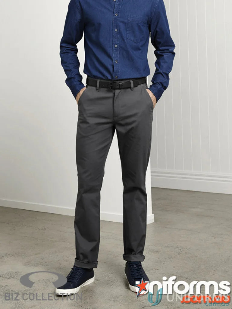 Man in blue shirt and gray Lawson Stretch Chino Pants from Biz Collection Mens