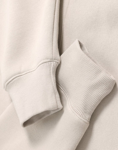 Cream-colored ribbed knit cuffs on a soft cotton premium oversized bone hoodie ideal for work uniforms and workwear