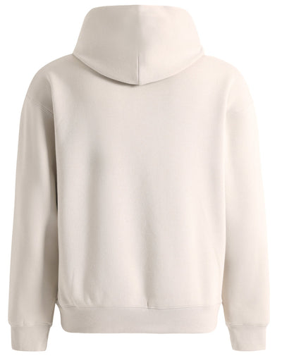Cream-colored premium oversized bone hoodie with soft textured fabric and ribbed cuffs perfect for workwear uniforms