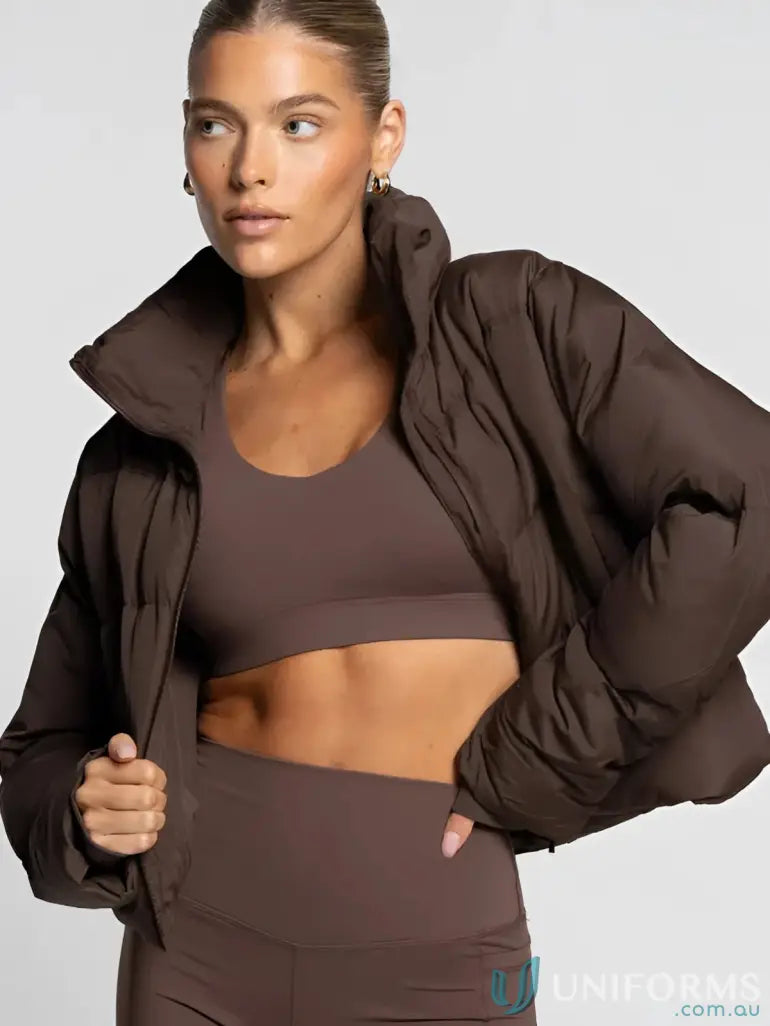 A plush chocolate-brown short puffer roast jacket with high collar and voluminous sleeves perfect for workwear uniforms