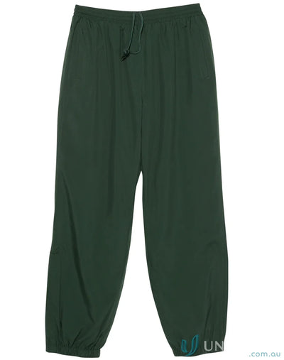 Dark green kids legend warm pants with zip-up leg openings from Winning Spirit Kids