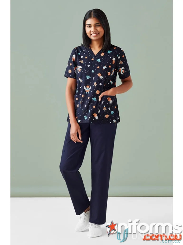 Woman wearing space-themed scrub top from Bizcare Women’s Printed Space Party Scrub collection